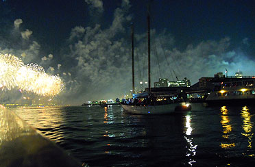 4th of july fireworks and boats at night in New York Harbor