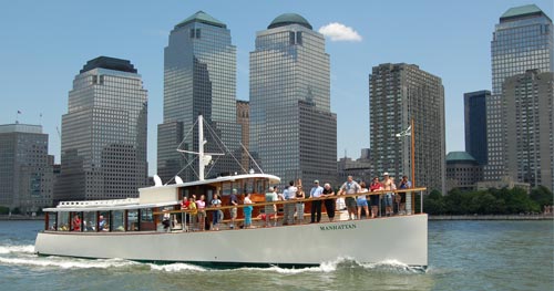 Yacht Manhattan in the Hudson River with the Financial District in the background
