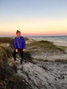 a woman posing on a beach