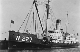 the Coast Guard Cutter, LILAC, sitting in a harbor