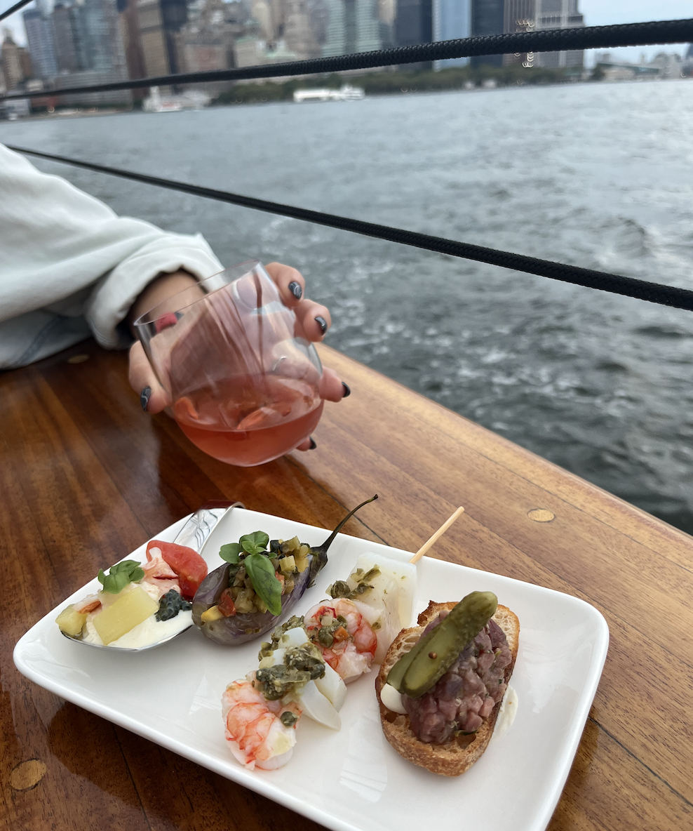 Plating of Marea at Sea bites and specialty cocktail aboard America 2.0 with Classic Harbor Line