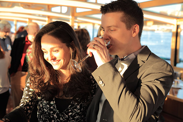 a couple having drinks on a yacht