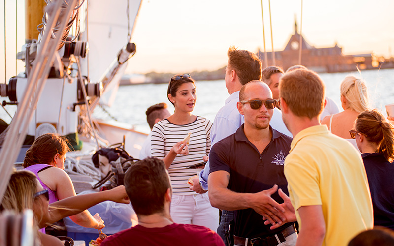 Private Charter with guests enjoying food and drink aboard the decks of Schooner America 2.0