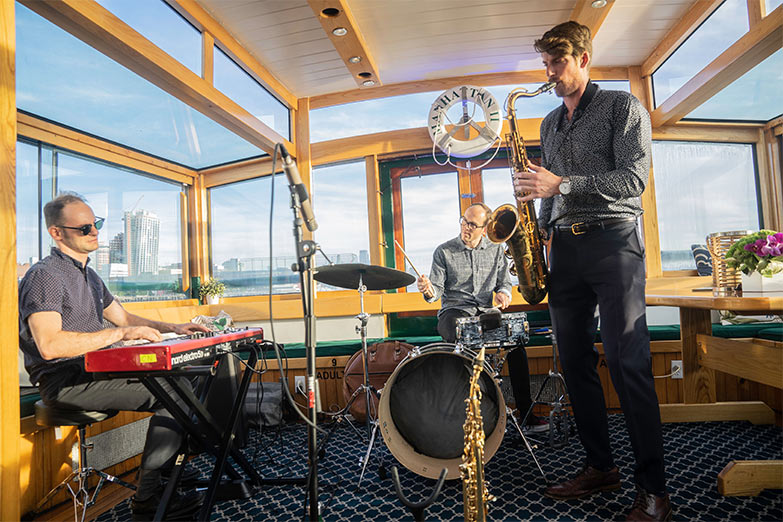 Live band playing holiday music on Yacht Manhattan II
