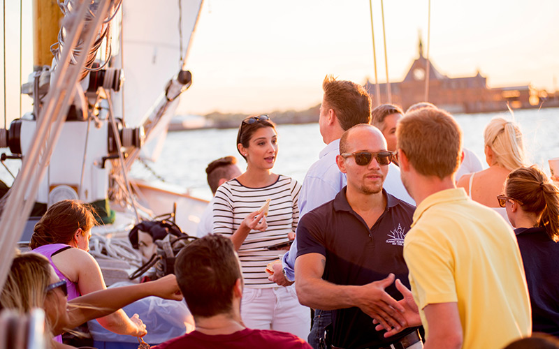 Private Charter with guests enjoying food and drink aboard the decks of Schooner America 2.0