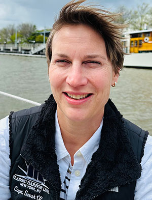 Portrait of Managing Director Sarah Pennington on aboard boat in Classic Harbor Line fleet