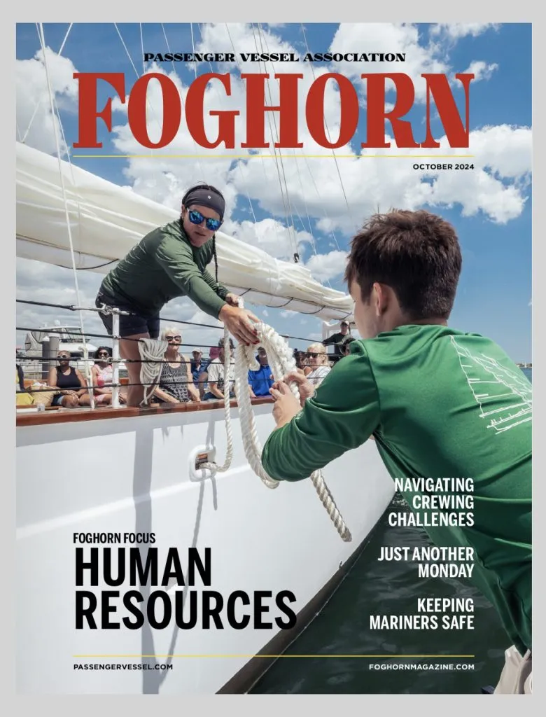 Classic Harbor Line's Adirondack IV, graces the cover of Foghorn Magazine with captain and mate passing lines.
