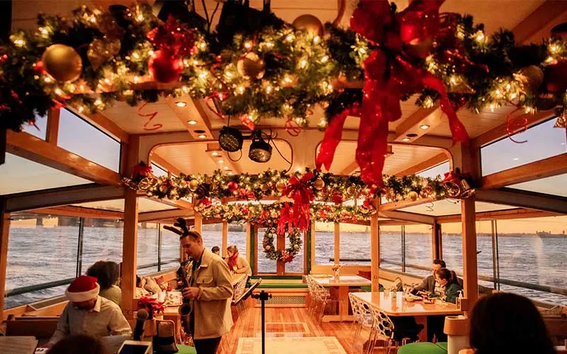 Interior of yacht Manhattan II decked out in Holiday decor