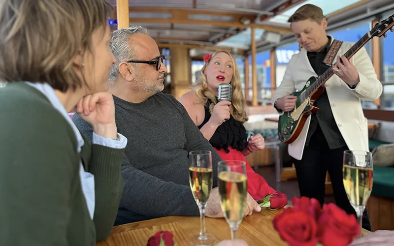 Serenade2 Singer and guitarist playing to a couple on a classic yacht in NYC
