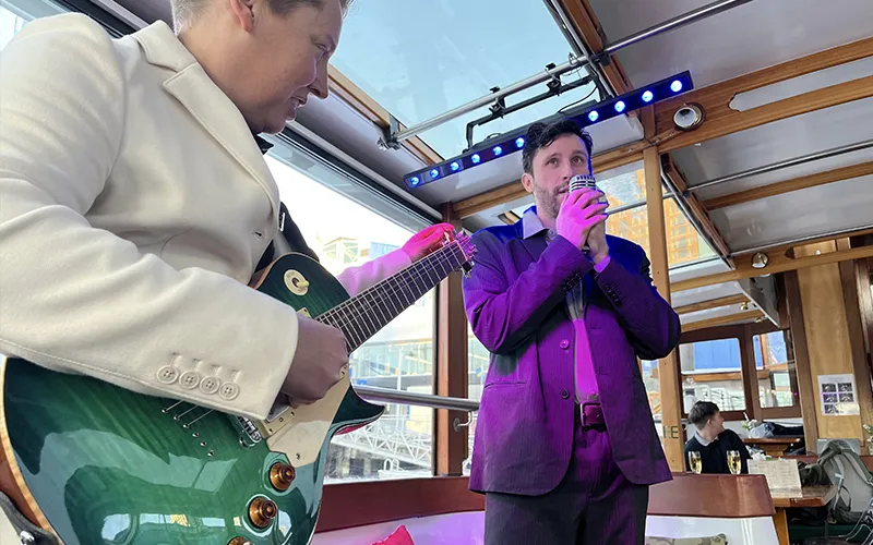 Serenade6 Guitarist and singer on a boat in NY Harbor