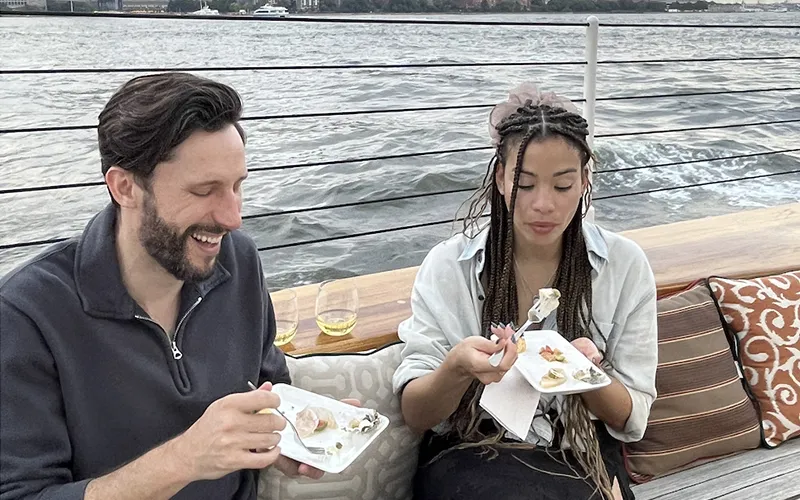 TidesTapas5 Couple on the Schooner America 2.0 for a sunset sail with food.