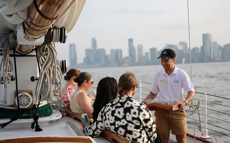 Tapas10 Crew serving drinks to guests aboard the Schooner America 2.0