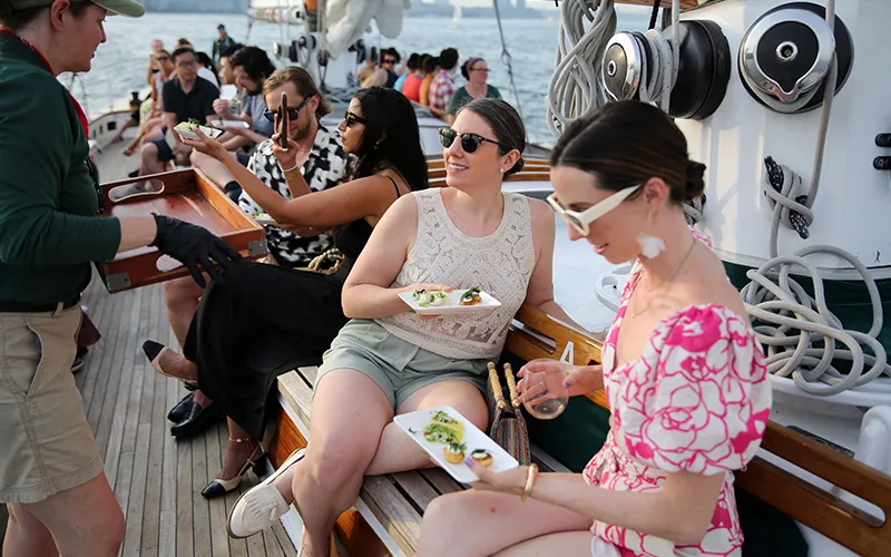 Tapas8 Two friends being served their hors d oeuvres on the schooner America 2.0