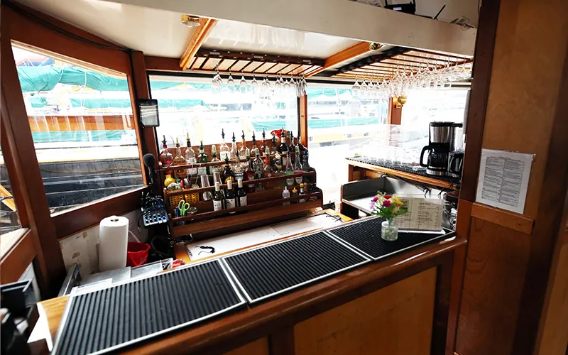 Yacht Manhattan Bar with liquor bottles and wine bottles