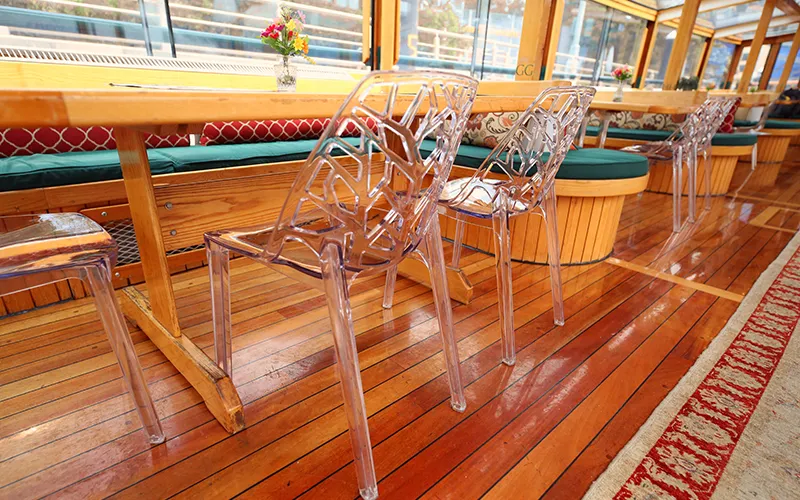 Chairs and table in the grand salon of yacht Manhattan II