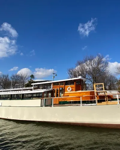 Yacht Manhattan III docked at Chelsea Piers in NYC on a sunny day