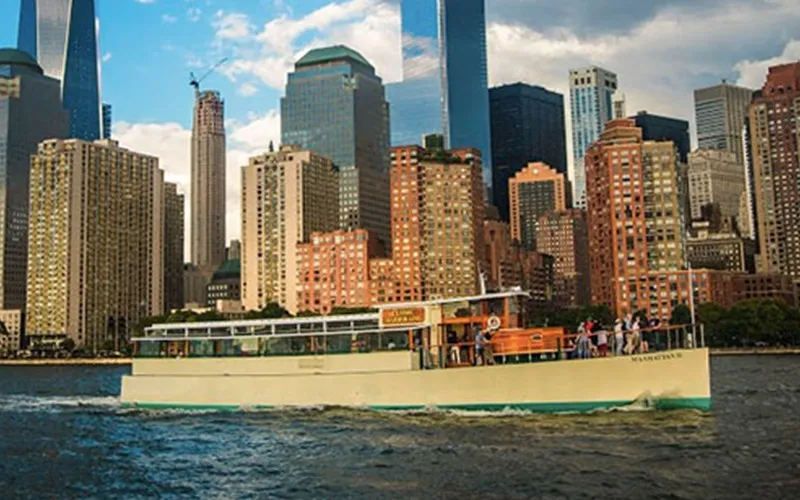 Sail250Harbor9 The Yacht Manhattan II cruising in NY Harbor with the skyline in the background