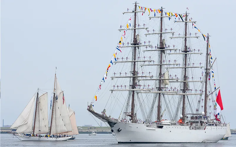 VIPSail250Manhattan A square rigged tall ship and a schooner sailing in NY Harbor