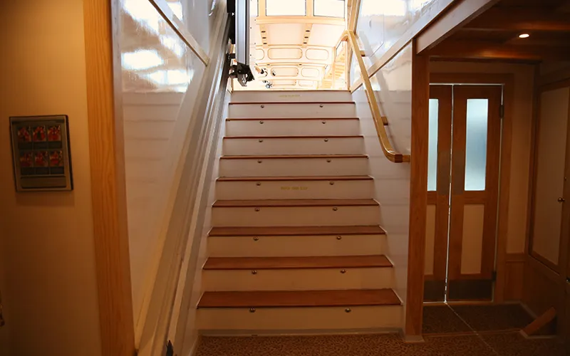 Staircase leading to the bathrooms aboard the yacht Manhattan III