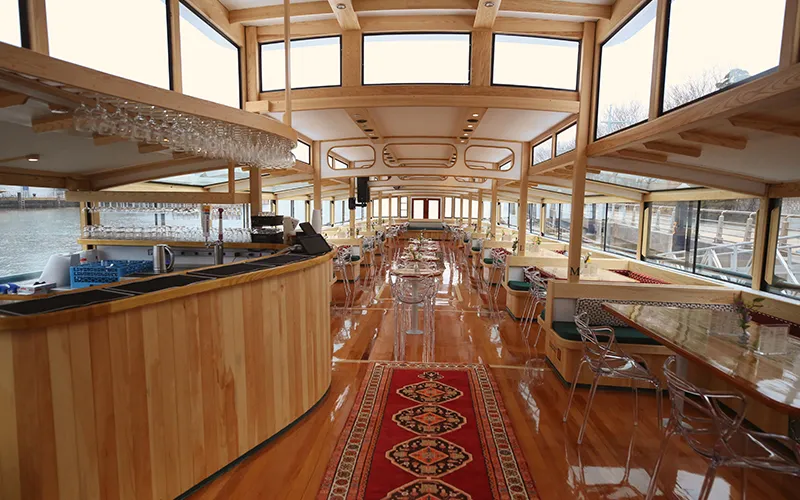 WebManIII23 Grand Salon of the Yacht Manhattan III showcasing the windows, tables and chairs