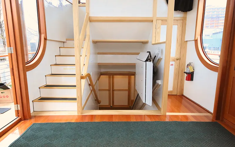 A lift chair for handicap accessibility to get up and down stairs on the yacht Manhattan III