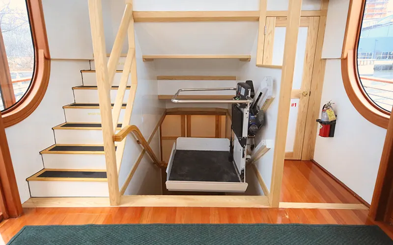 A lift chair for handicap accessibility to get up and down stairs on the yacht Manhattan III