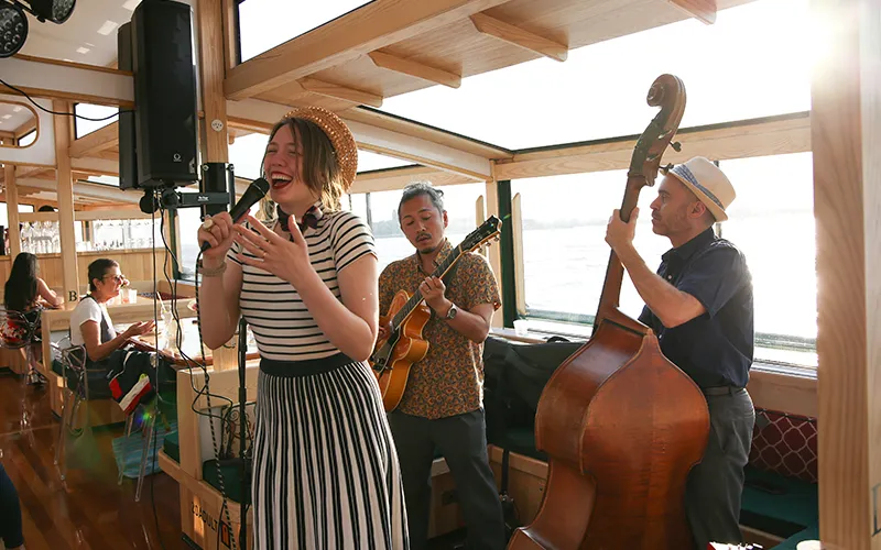 A jazz band playing on a boat