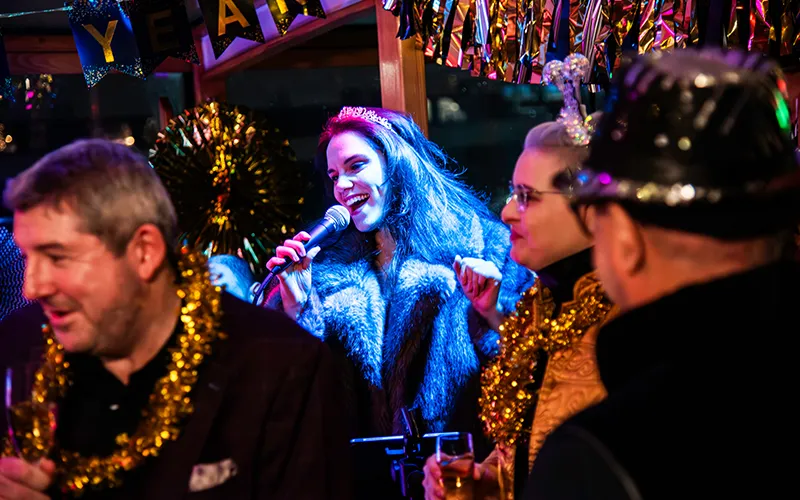 NewYear10 Close up of the singer of a New Year's Eve Band on a yacht in NY Harbor