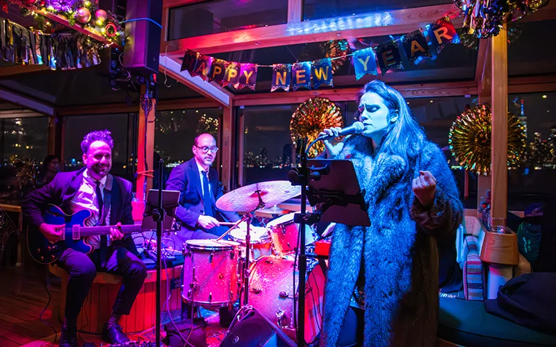 NewYear14 Band playing music with New Year's Eve Decorations surrounding them