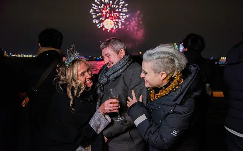 NewYear15 Group of friends watching Fireworks on a boat in NY Harbor