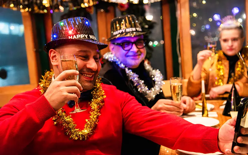 NewYear7 Guy taking a photo of him and a friend in their New Year's Eve clothing