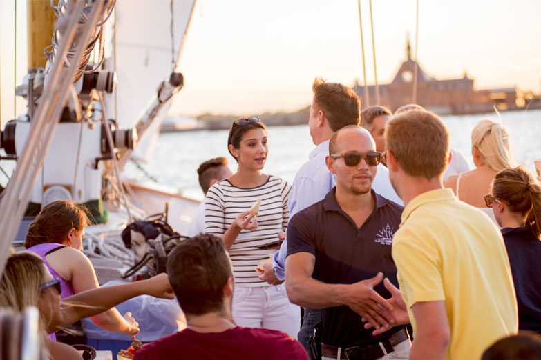Private Charter with guests enjoying food and drink aboard the decks of Schooner America 2.0
