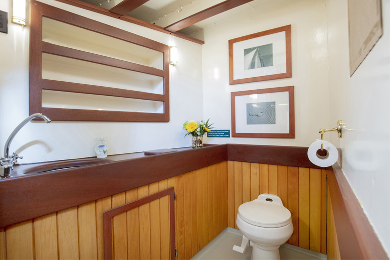 Photo of the bathroom aboard yacht Manhattan showcasing the beautiful woodwork 