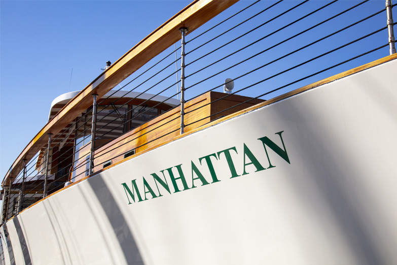 Bow photo showcasing the name of the boat: Yacht Manhattan
