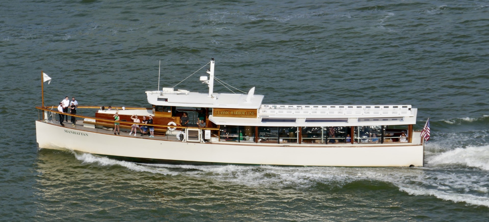 Full boat photo of the classic Yacht Manhattan cruising on an Architecture tour in NY Harbor